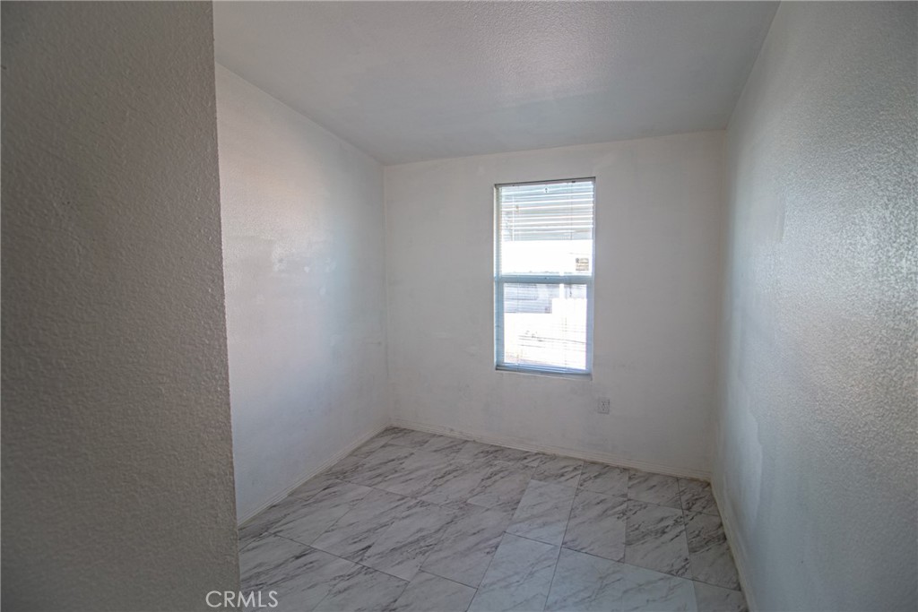4444 East Ave R, Unit 202 Palmdale, CA 93552 - Photo 12 of 23 an empty room with a window