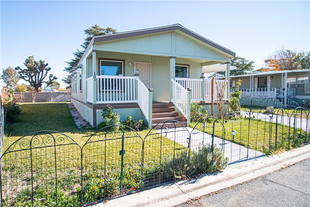 4444 East Ave R, Unit 202 Palmdale, CA 93552 - Photo 2 of 23 a view of a house with a swimming pool