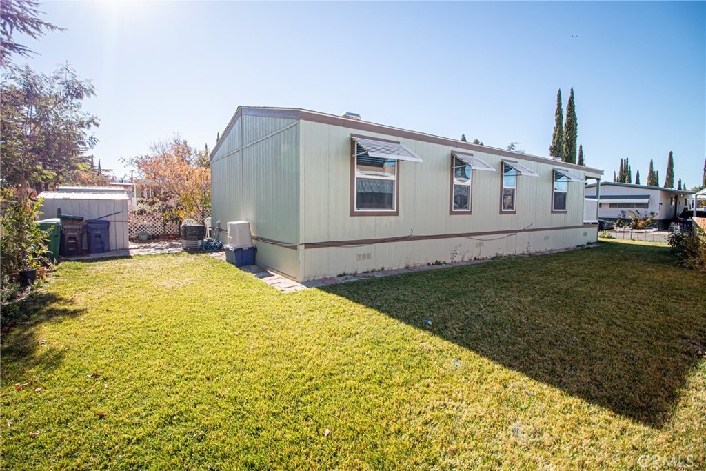 4444 East Ave R, Unit 202 Palmdale, CA 93552 - Photo 3 of 23 a view of a house with a backyard