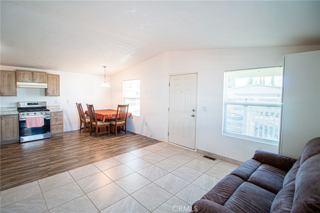 4444 East Ave R, Unit 202 Palmdale, CA 93552 - Photo 7 of 23 a living room with furniture and a window