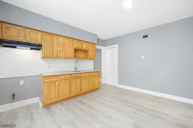 a bathroom with a sink a toilet and a bathtub