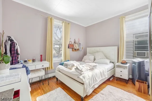 a kitchen with lots of white appliances and chandelier