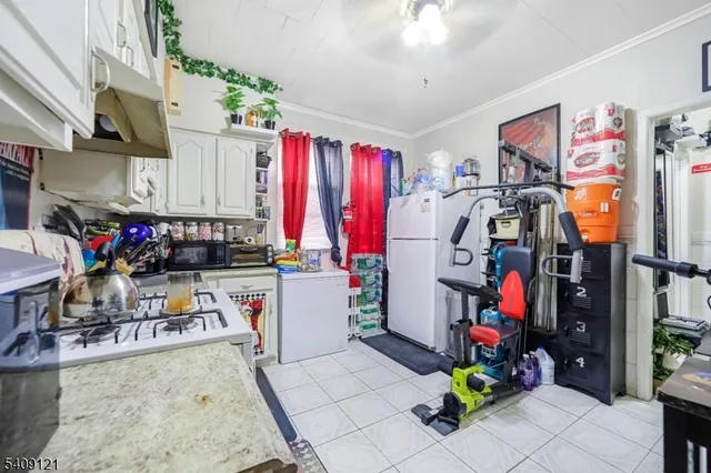 a bed room with a bed and a television