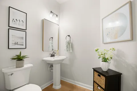 a bathroom with a sink a mirror and a toilet
