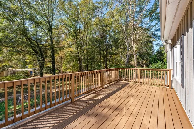 a view of balcony with wooden floor