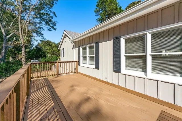 a balcony view with wooden floor and fence
