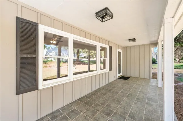 a view of an entryway with wooden floor