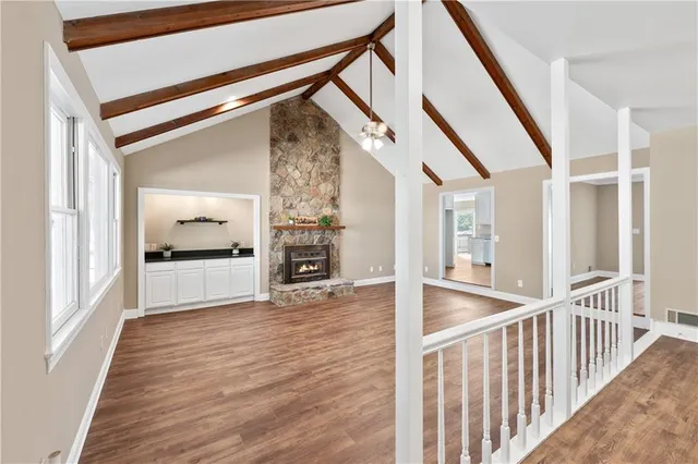 a view of an entryway with wooden floor and door