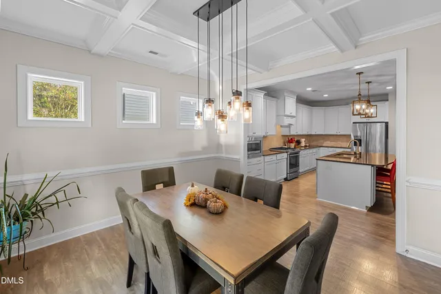 a kitchen with a table and chairs in it