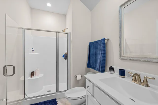 a bathroom with a double vanity sink mirror and