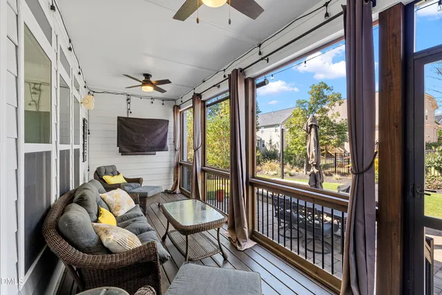 a view of a patio with table and chairs and potted plants