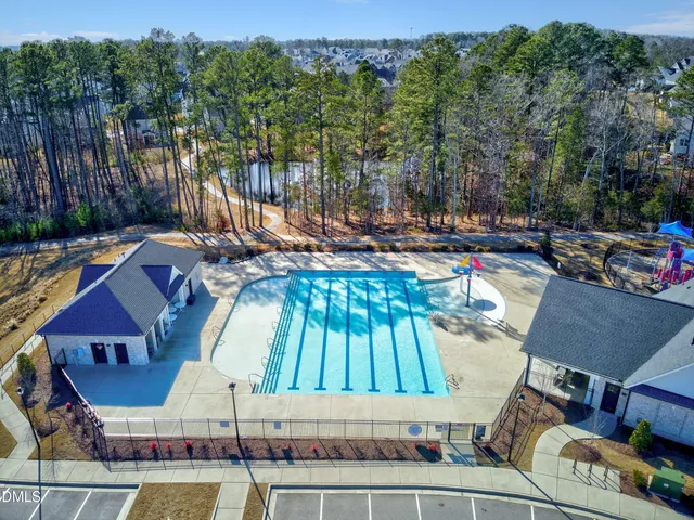 a aerial view of a house with backyard and porch