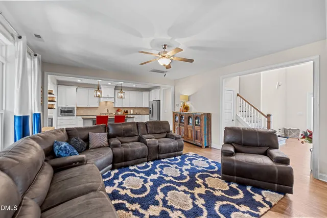 a living room with furniture and a rug