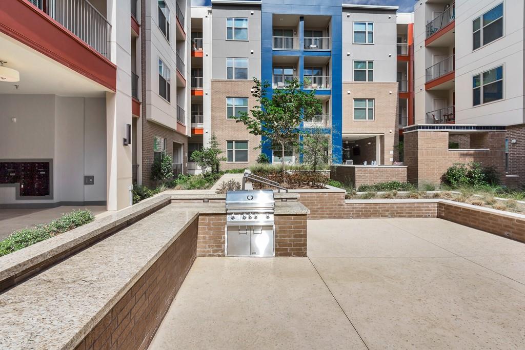 10550 North Central Expressway, Unit 161 Dallas, TX 75231 - Photo 7 of 9 a view of a building with yard