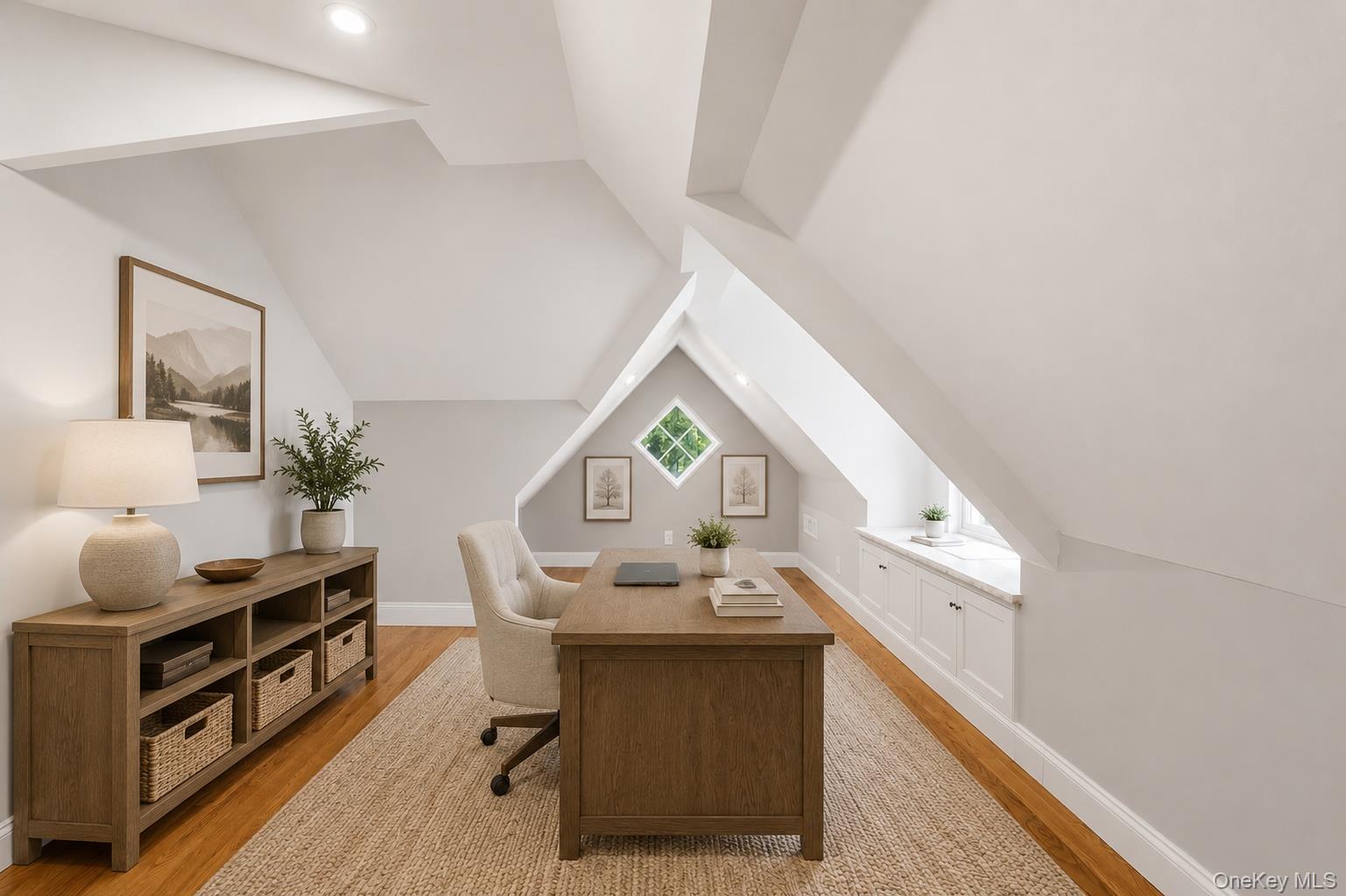 12 Leeside Road Carmel, NY 10512 - Photo 27 of 44 Attic space featuring pitched ceilings, wood-finish flooring, built-in recessed lighting, and a built-in window seat with cabinetry