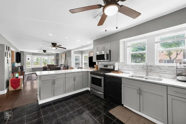 a kitchen with sink cabinets and window