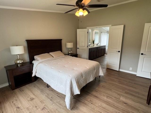 131 Lipan Trail Weatherford, TX 76087 - Photo 11 of 25 a bedroom with a bed and a chandelier