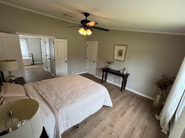 131 Lipan Trail Weatherford, TX 76087 - Photo 12 of 25 a bedroom with a bed and a chandelier