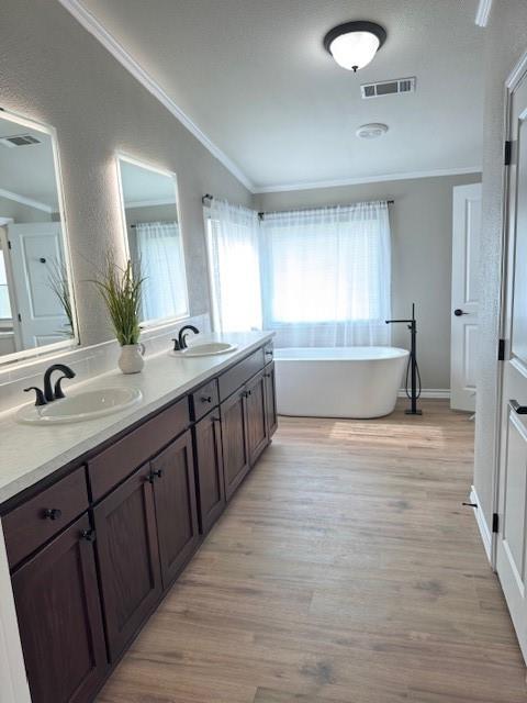 131 Lipan Trail Weatherford, TX 76087 - Photo 13 of 25 a bathroom with a sink double vanity granite tub shower and a mirror
