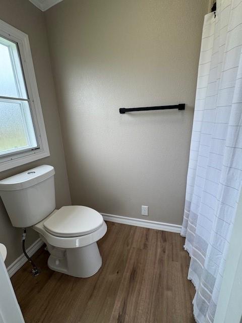 131 Lipan Trail Weatherford, TX 76087 - Photo 17 of 25 a white toilet sitting next to a small sink
