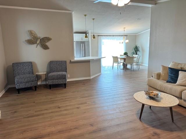 131 Lipan Trail Weatherford, TX 76087 - Photo 4 of 25 a living room with furniture and a wooden floor