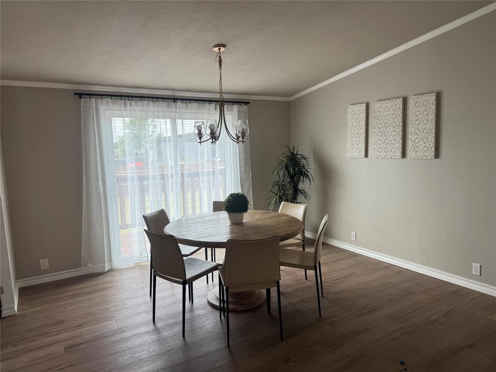 131 Lipan Trail Weatherford, TX 76087 - Photo 9 of 25 a view of a dining room with furniture window and wooden floor