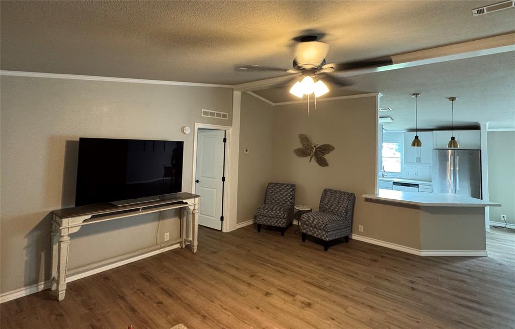 131 Lipan Trail Weatherford, TX 76087 - Photo 10 of 25 a living room with furniture and a flat screen tv