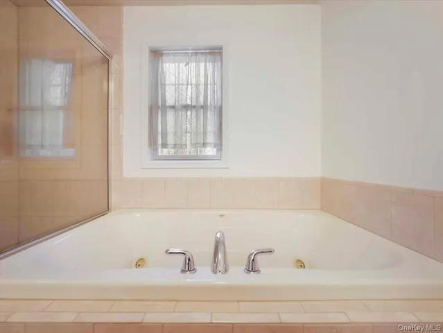 a bathroom with bathtub