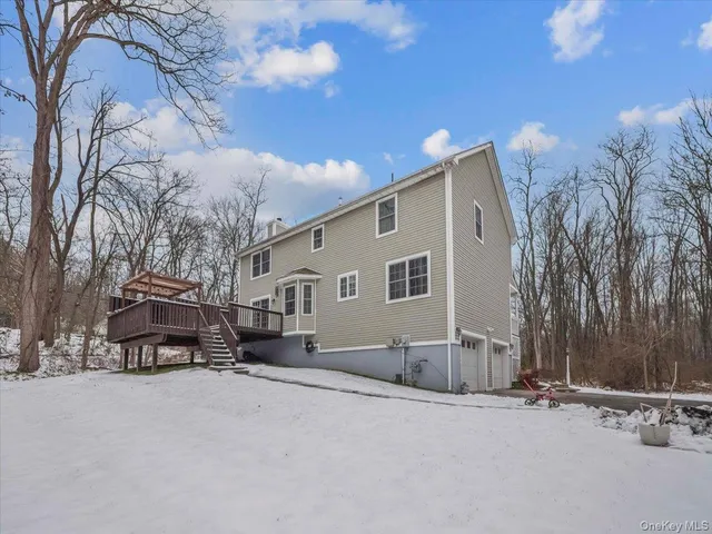 a view of a house with a snow in a yard