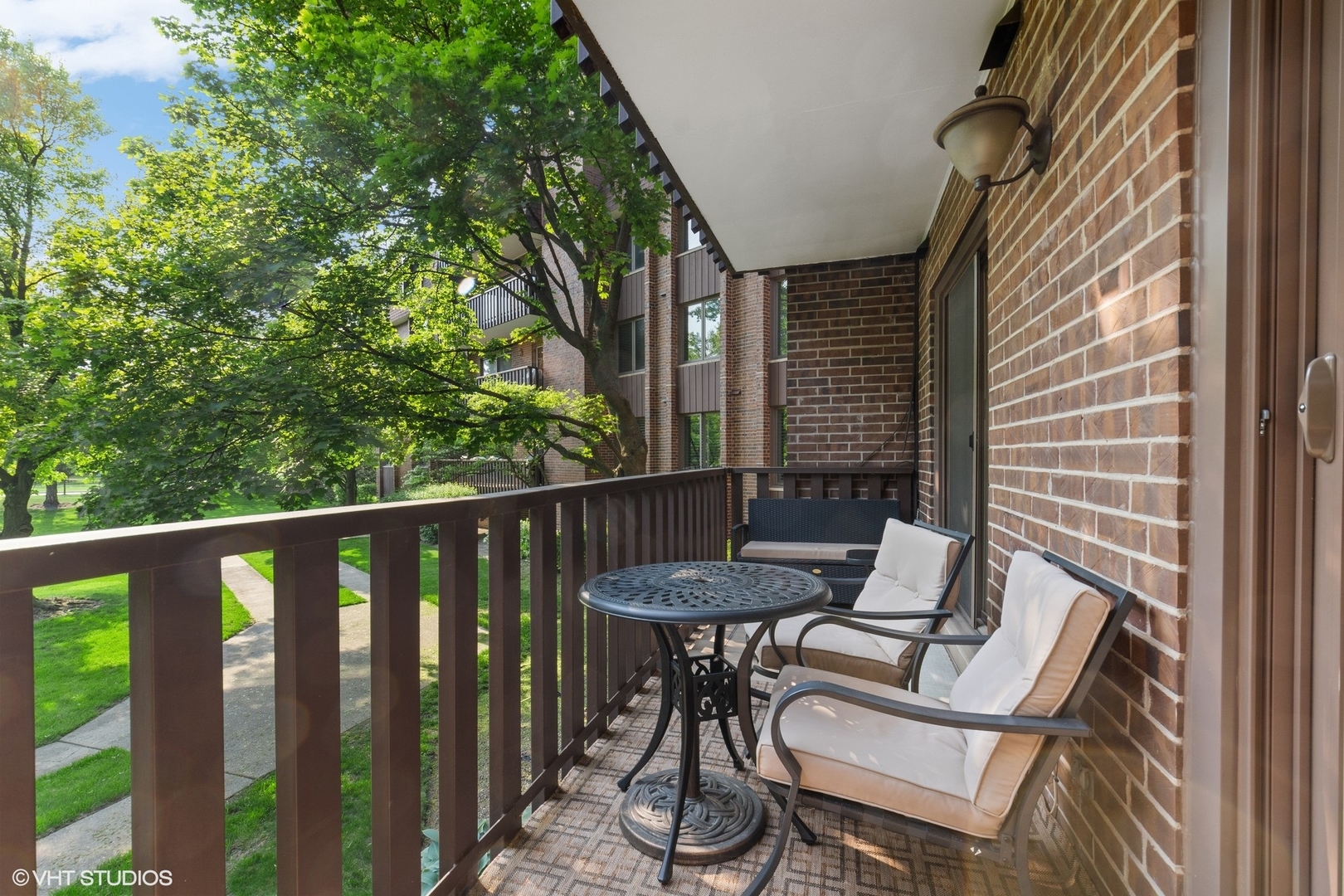 1175 Lake Cook Road, Unit 204 Northbrook, IL 60062 - Photo 16 of 20 a view of a chair and table in the balcony