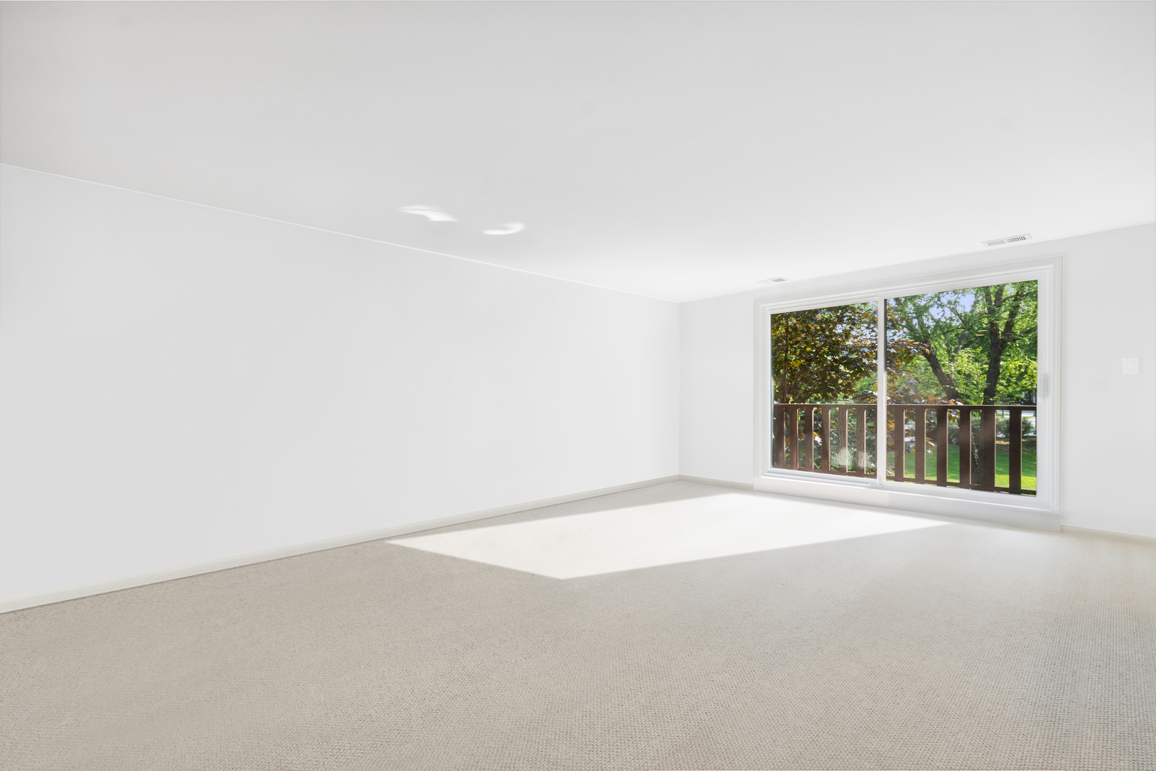 1175 Lake Cook Road, Unit 204 Northbrook, IL 60062 - Photo 3 of 20 a view of an empty room with a window