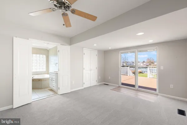 a view of a kitchen with a sink and a window