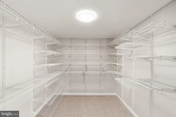 a bathroom with a granite countertop sink mirror and shower