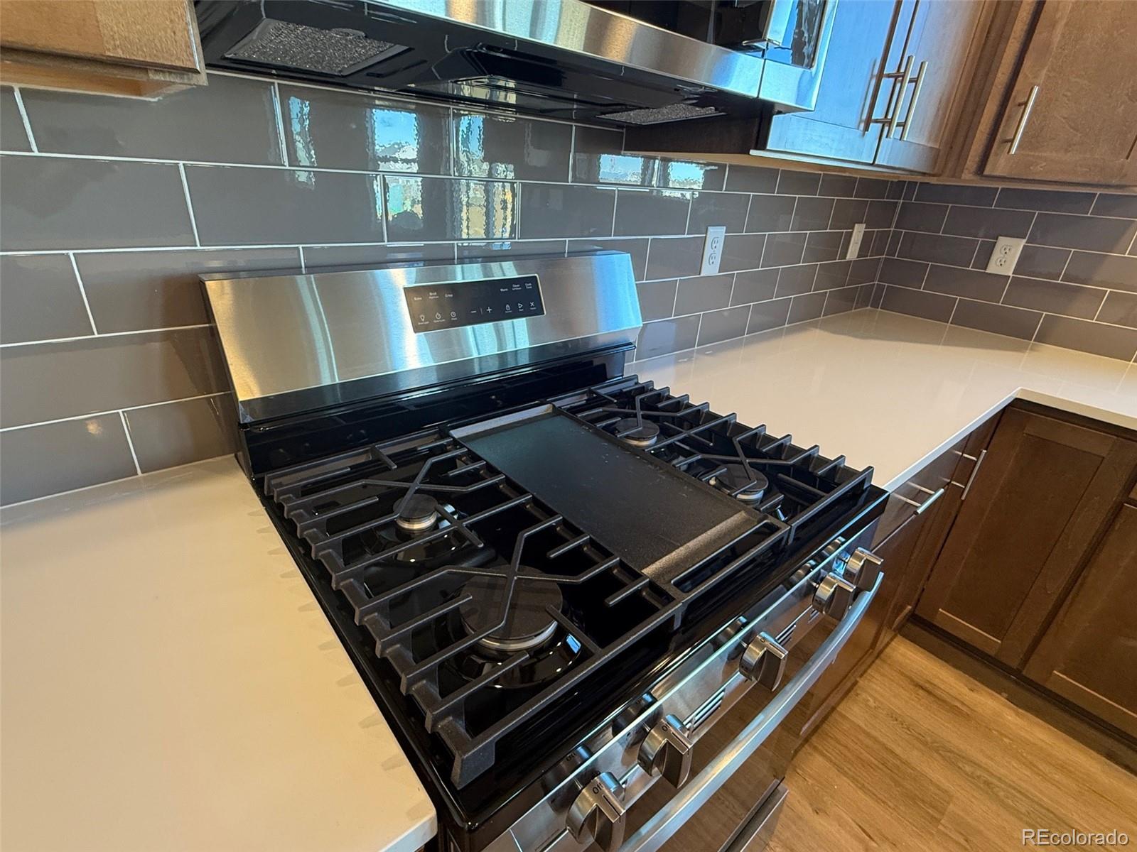 757 North Clubview Street Watkins, CO 80137 - Photo 5 of 24 a close up of a stove