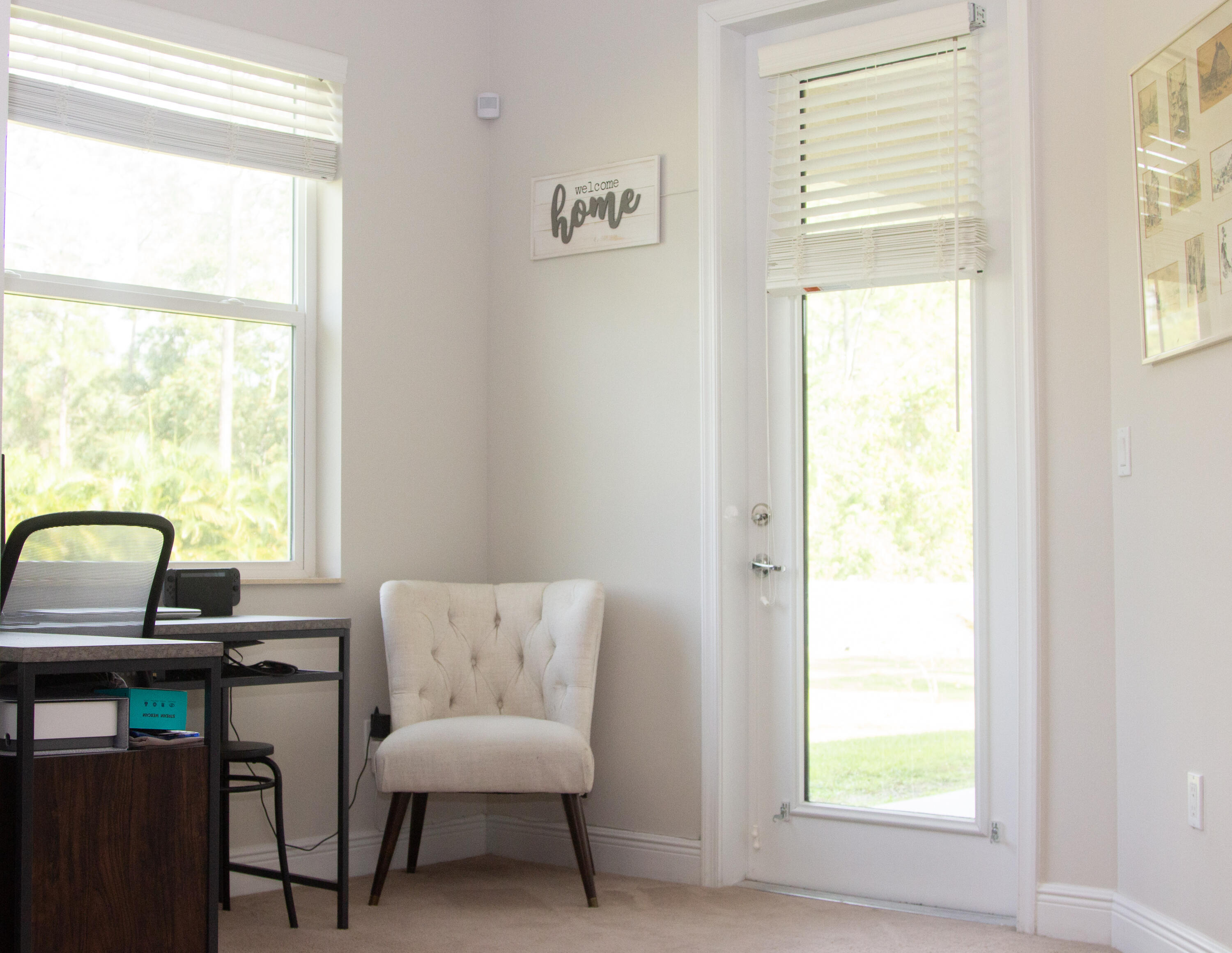 12601 57th Road North West Palm Beach, FL 33411 - Photo 14 of 24 a view of a workspace with furniture and a window