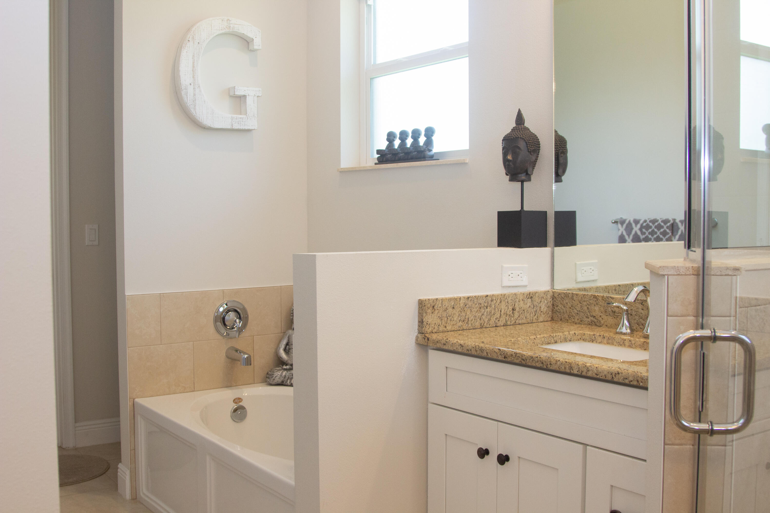 12601 57th Road North West Palm Beach, FL 33411 - Photo 16 of 24 a bathroom with a sink and a mirror