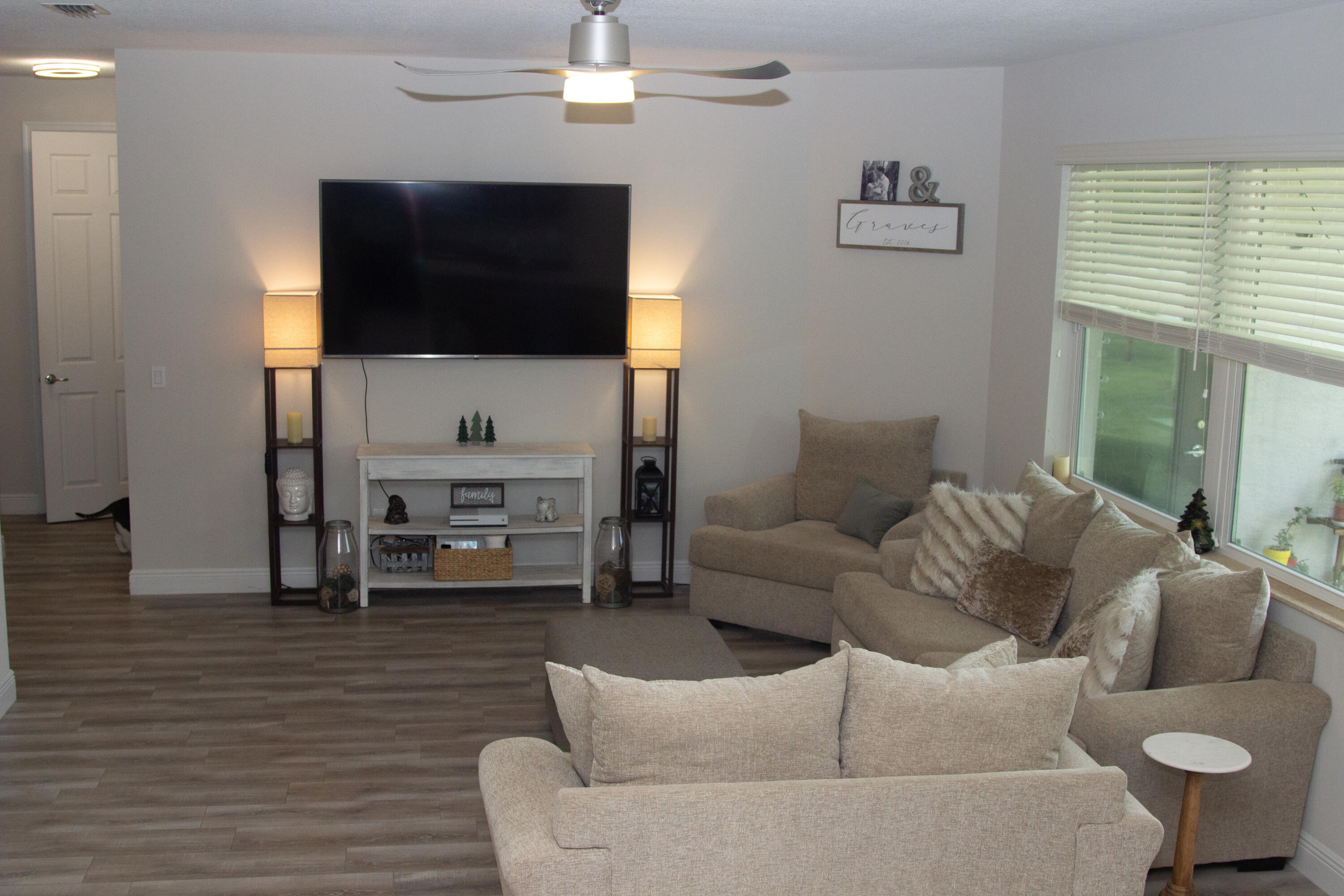 12601 57th Road North West Palm Beach, FL 33411 - Photo 4 of 24 a living room with furniture and a flat screen tv
