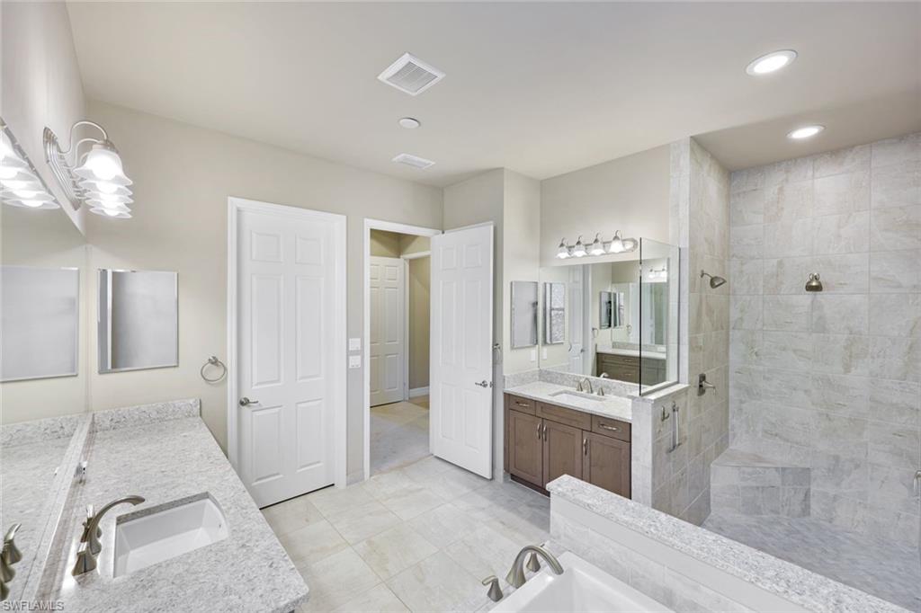 4394 Caldera Circle Naples, FL 34119 - Photo 19 of 39 a bathroom with a sink a toilet and shower