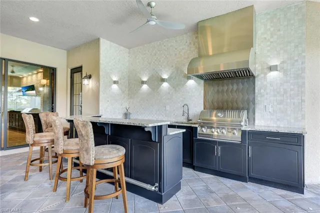 a kitchen with a table and chairs in it
