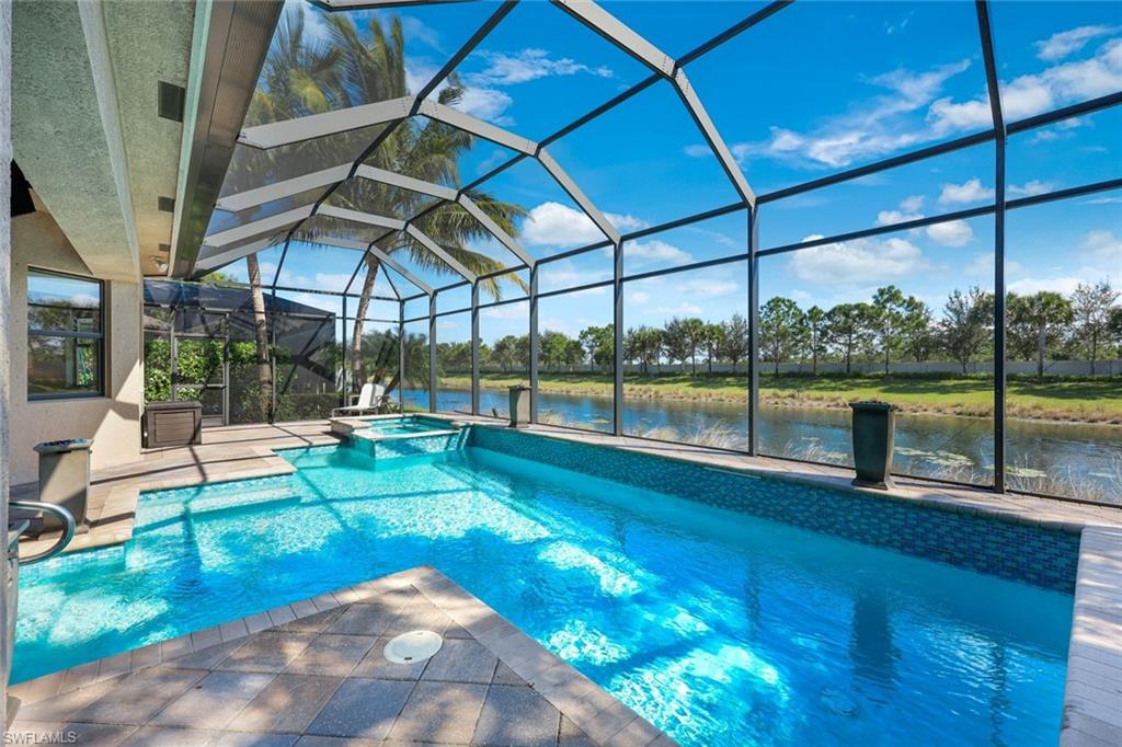 4394 Caldera Circle Naples, FL 34119 - Photo 32 of 39 a view of a backyard with sitting area