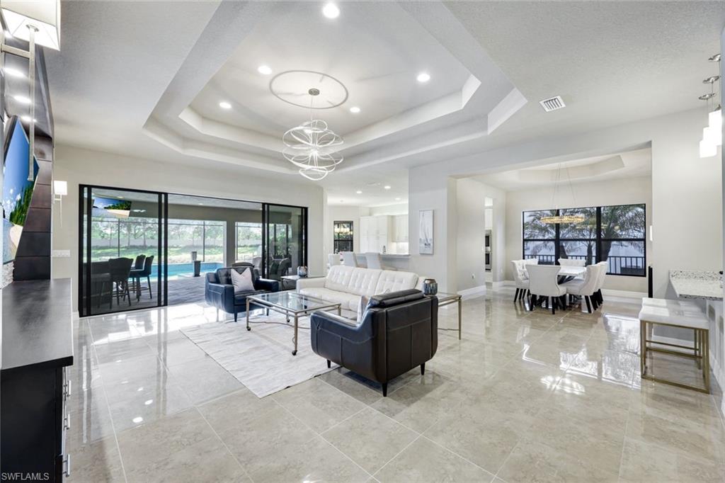 4394 Caldera Circle Naples, FL 34119 - Photo 4 of 39 a living room with furniture and a view of living room