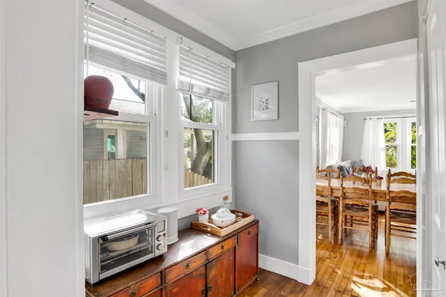 a room that has a bed and a table in it