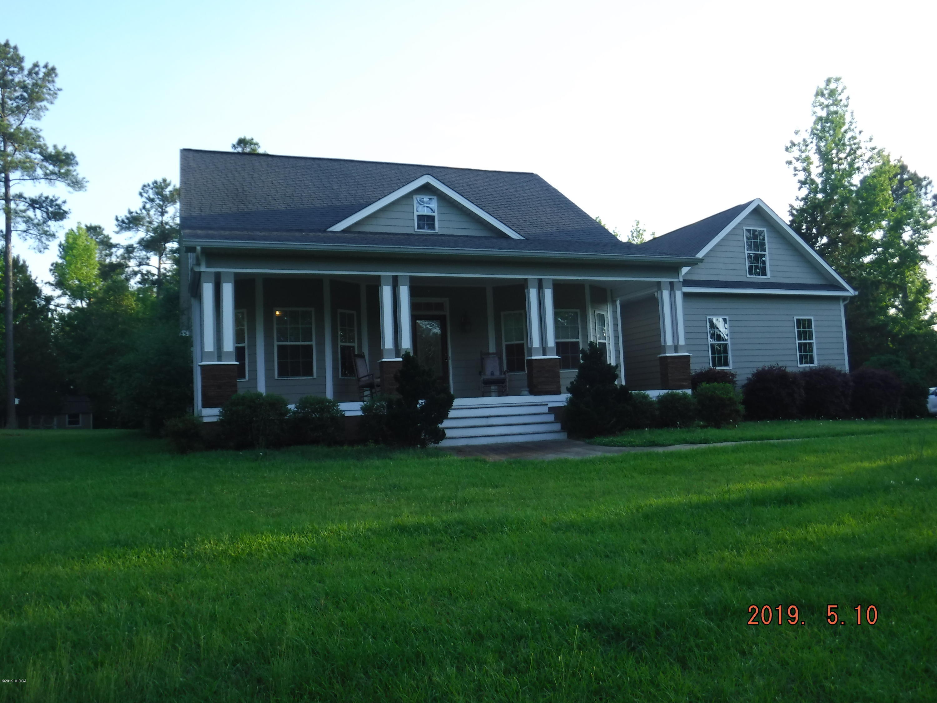a view of a house with a garden