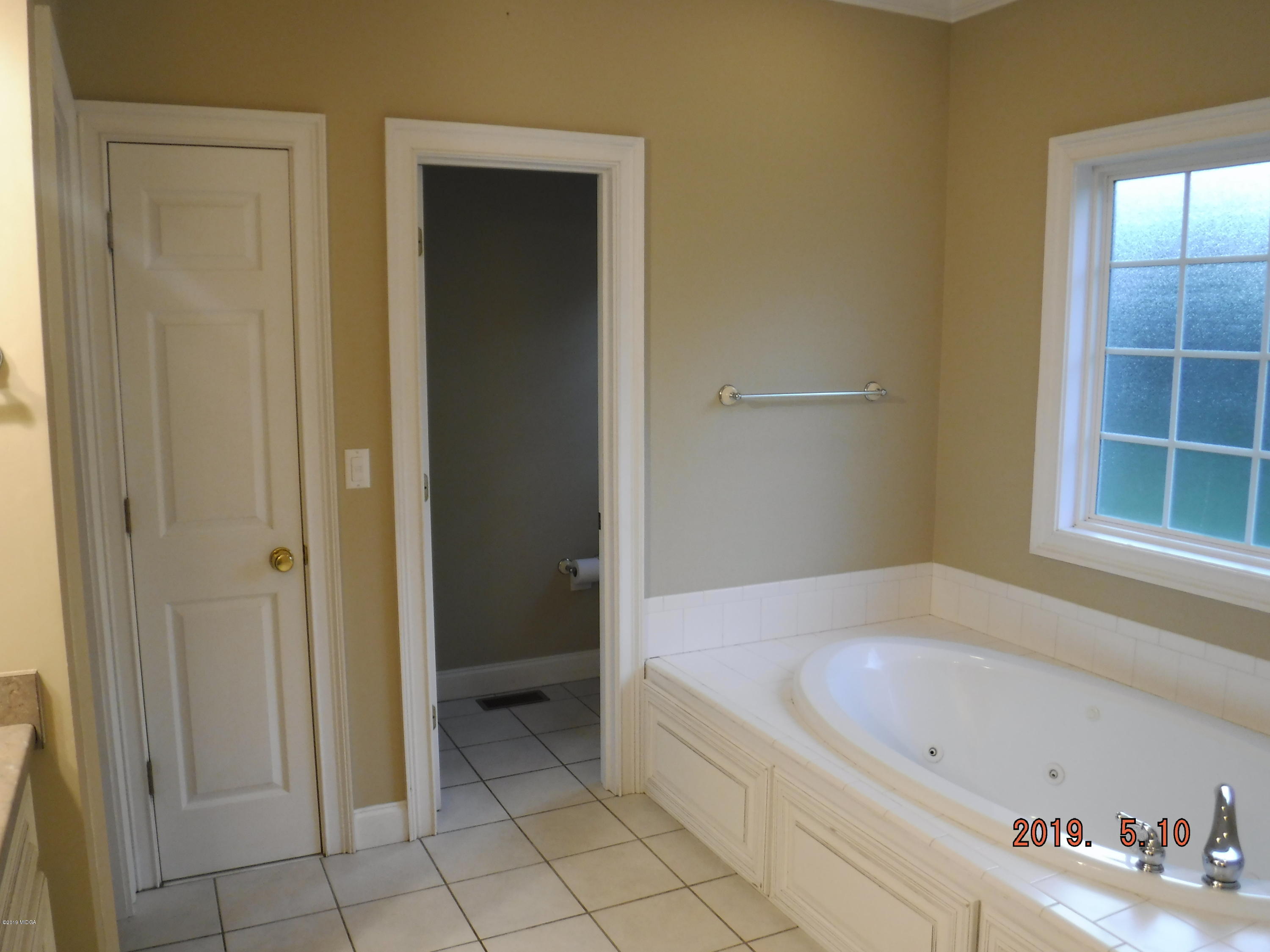 755 Charles Johnson Road Forsyth, GA 31029 - Photo 14 of 35 a bathroom with a tub and shower