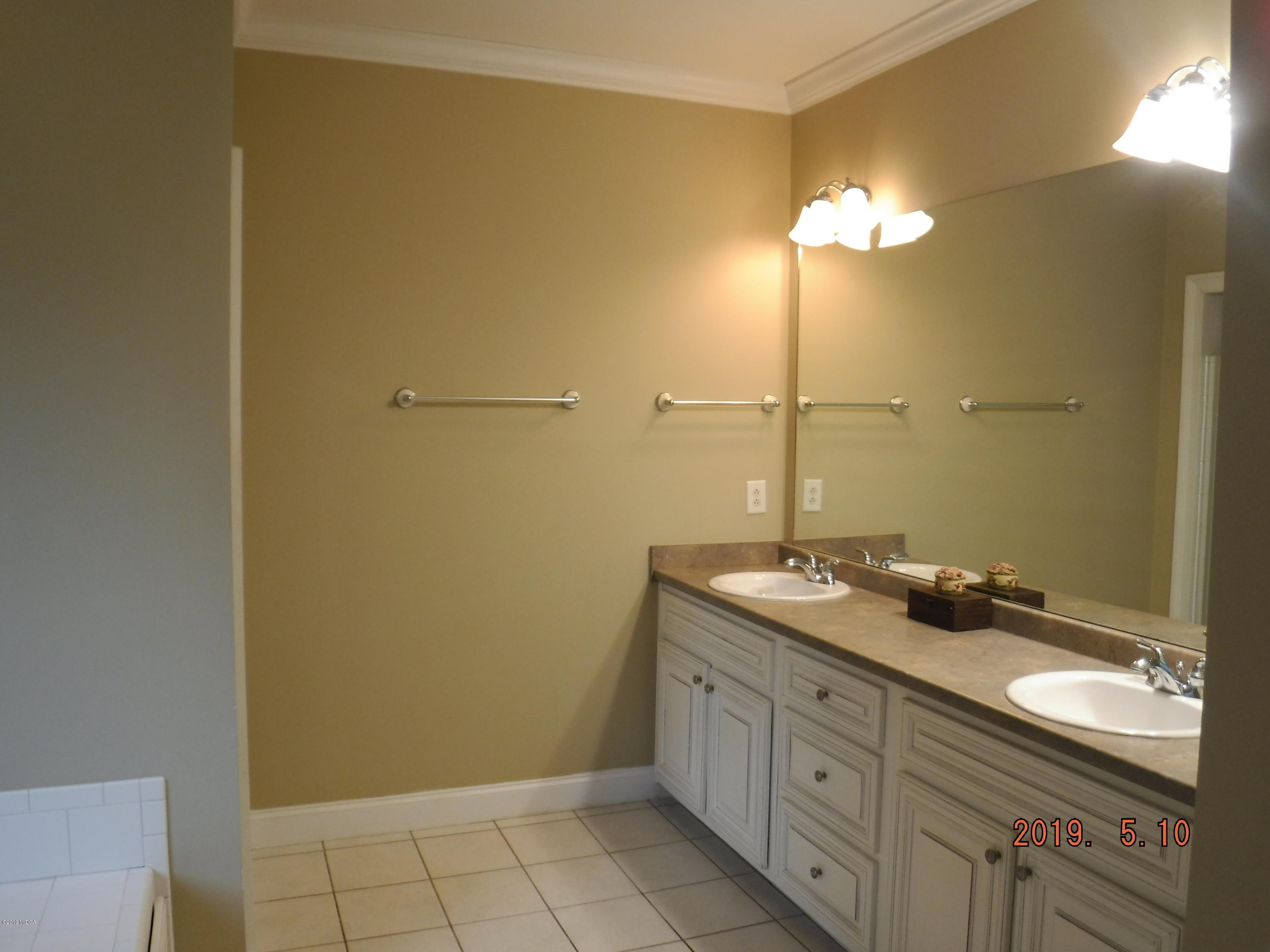 755 Charles Johnson Road Forsyth, GA 31029 - Photo 16 of 35 a bathroom with a granite countertop sink and a mirror