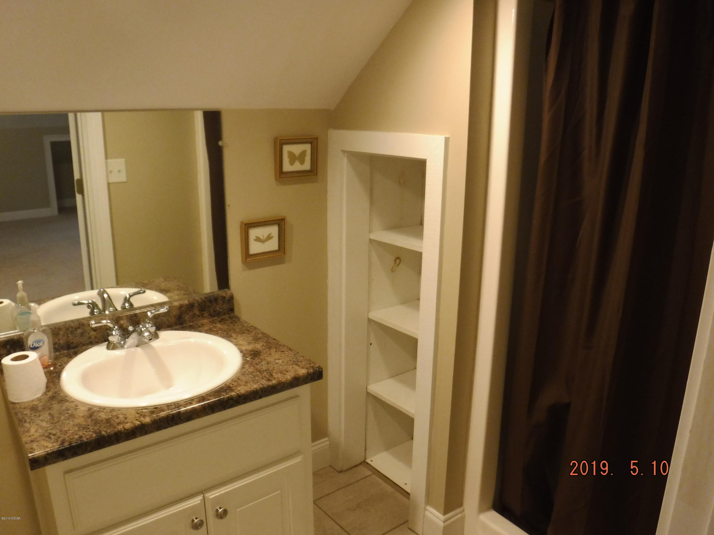 755 Charles Johnson Road Forsyth, GA 31029 - Photo 20 of 35 a bathroom with a sink and a mirror