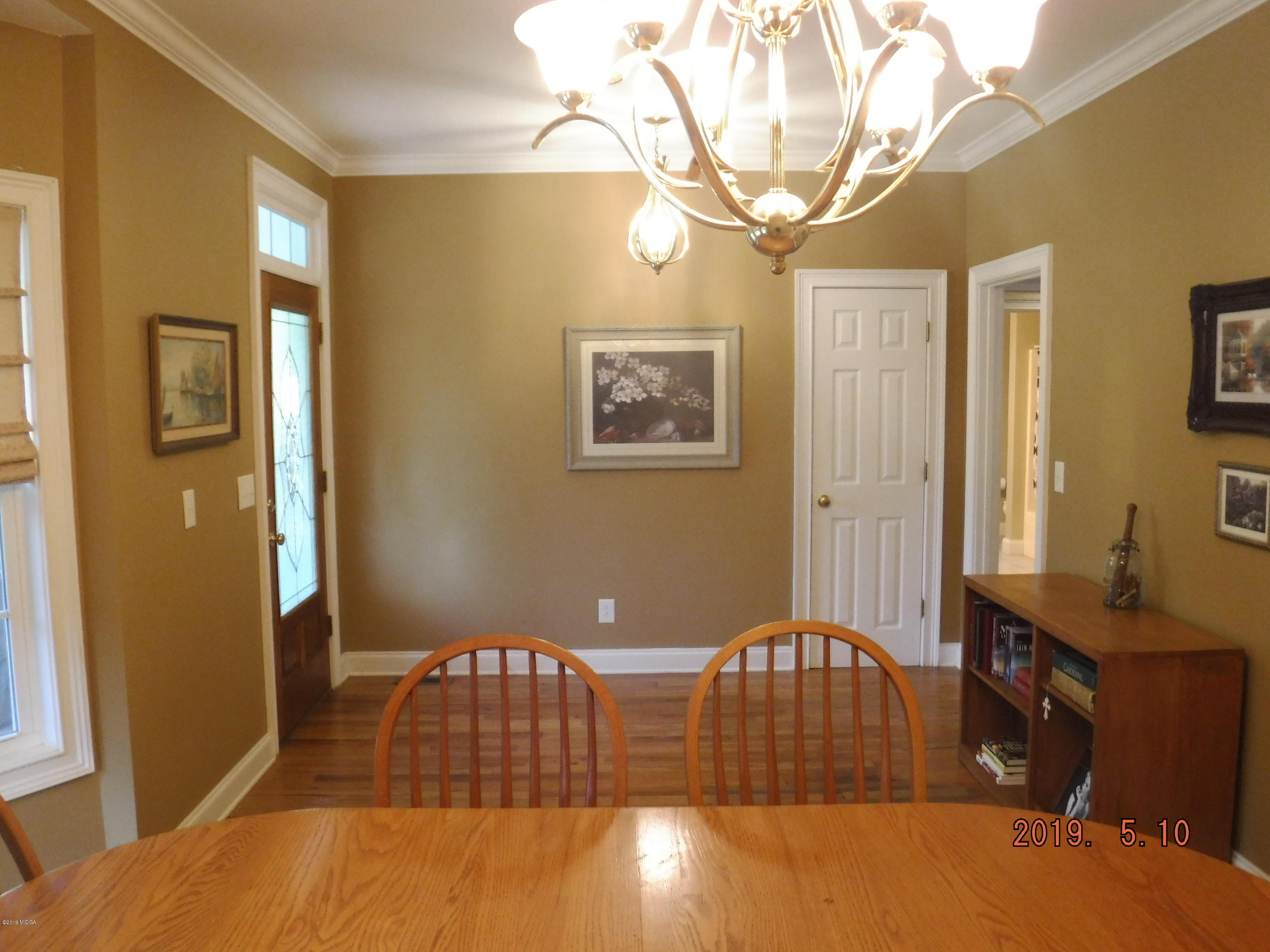 755 Charles Johnson Road Forsyth, GA 31029 - Photo 21 of 35 a bedroom with bed and wooden floor