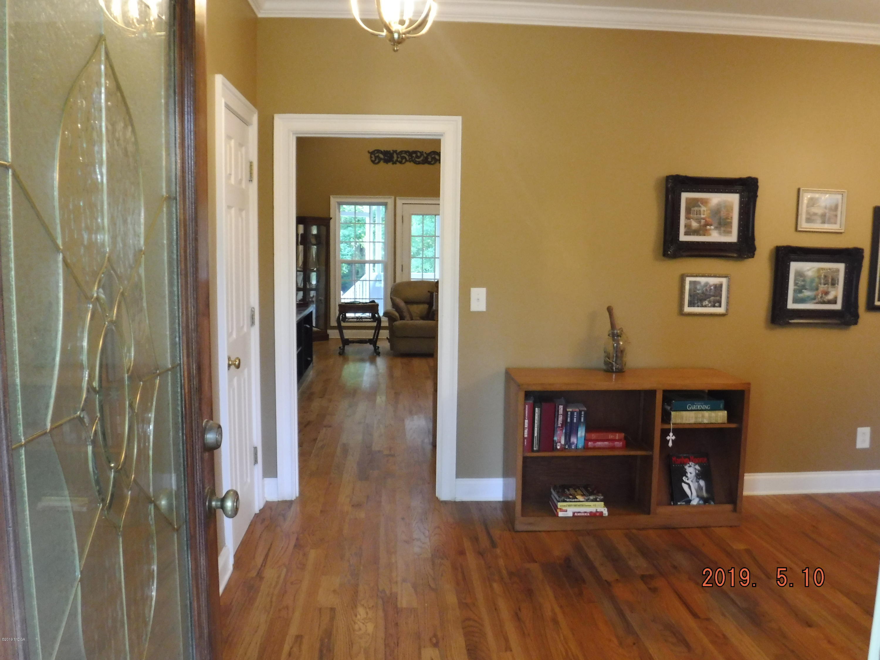 755 Charles Johnson Road Forsyth, GA 31029 - Photo 23 of 35 a view of a livingroom with furniture and wooden floor