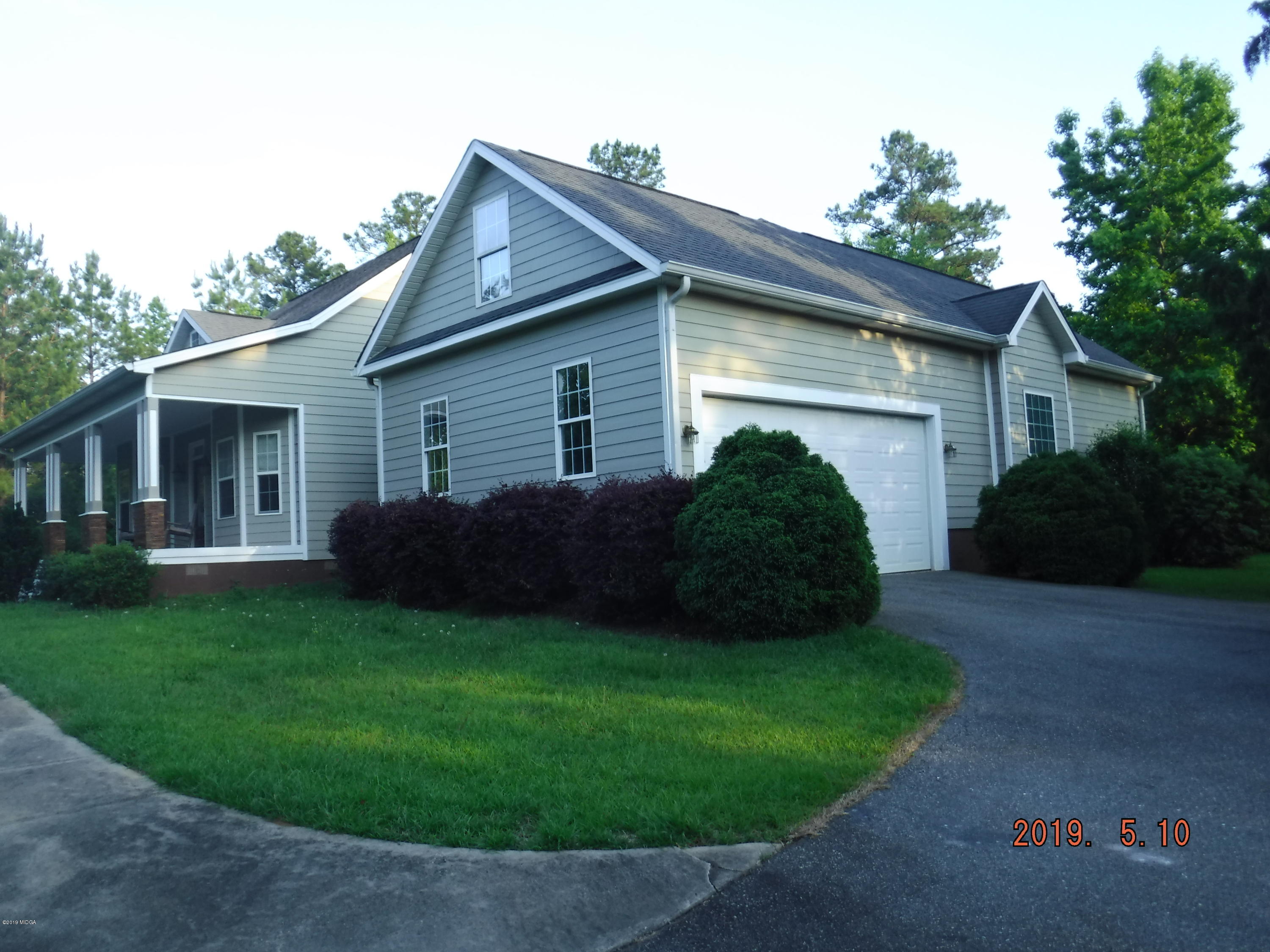755 Charles Johnson Road Forsyth, GA 31029 - Photo 32 of 35 a view of a yard in front of house