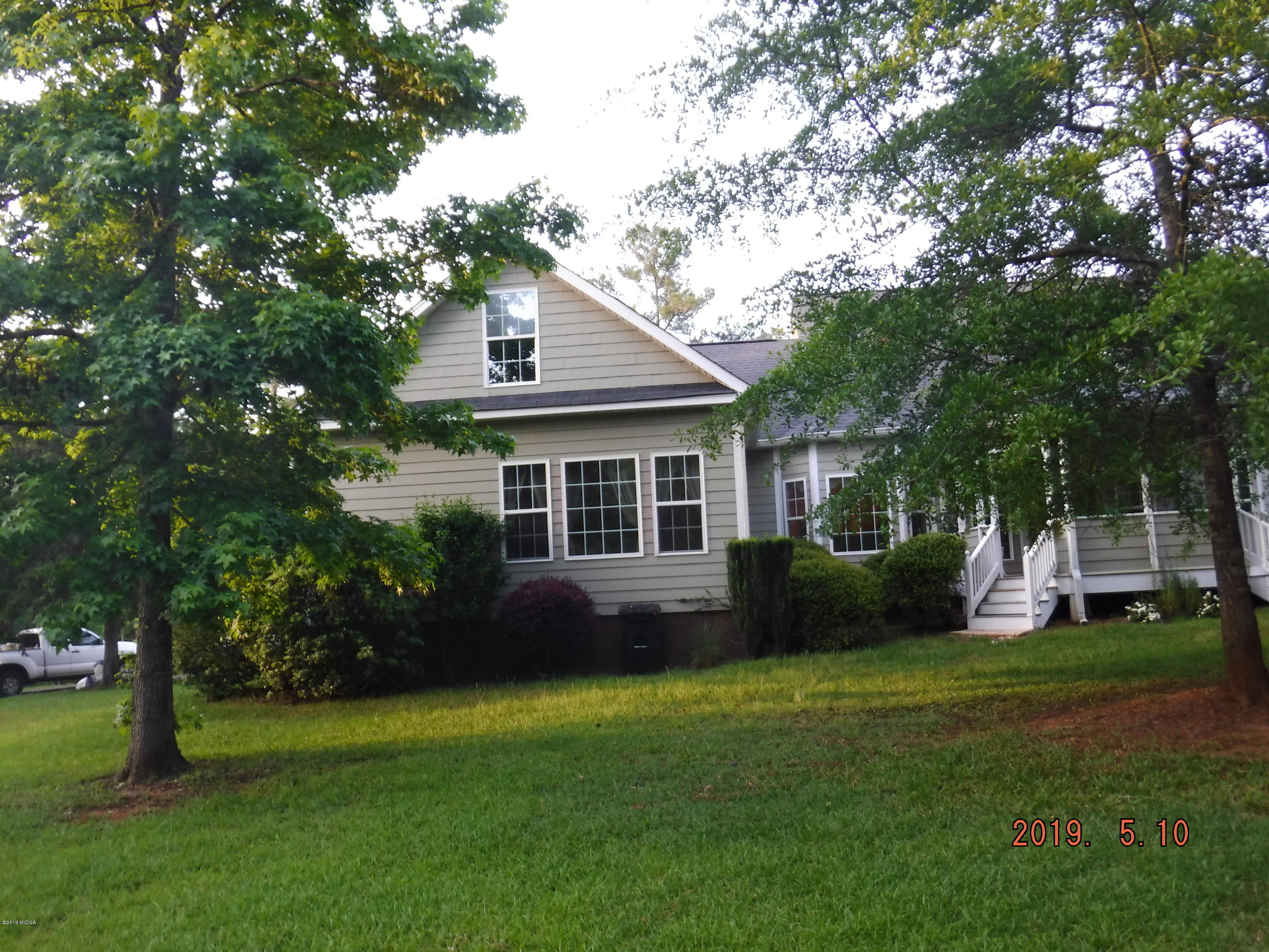 755 Charles Johnson Road Forsyth, GA 31029 - Photo 33 of 35 a house view with a garden space